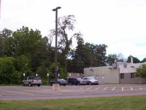 Building 520 The University of Rochester Building 520 parking lot shows all but one car parked in handicapped-accessible spaces.